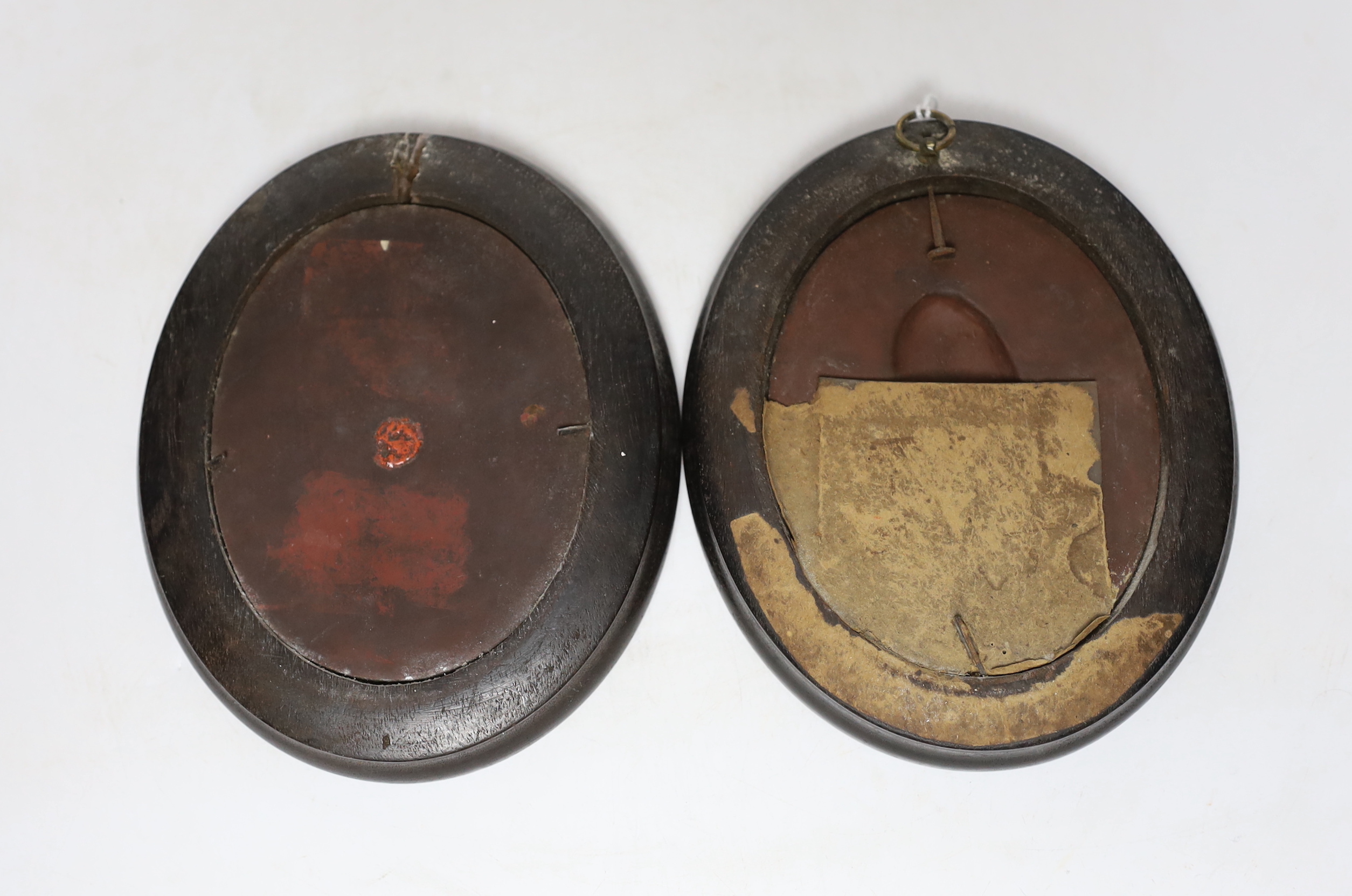 After Isaac Gosset, a pair of oval cream glazed terracotta portrait plaques of George II and George III?, 10cm high not including frames